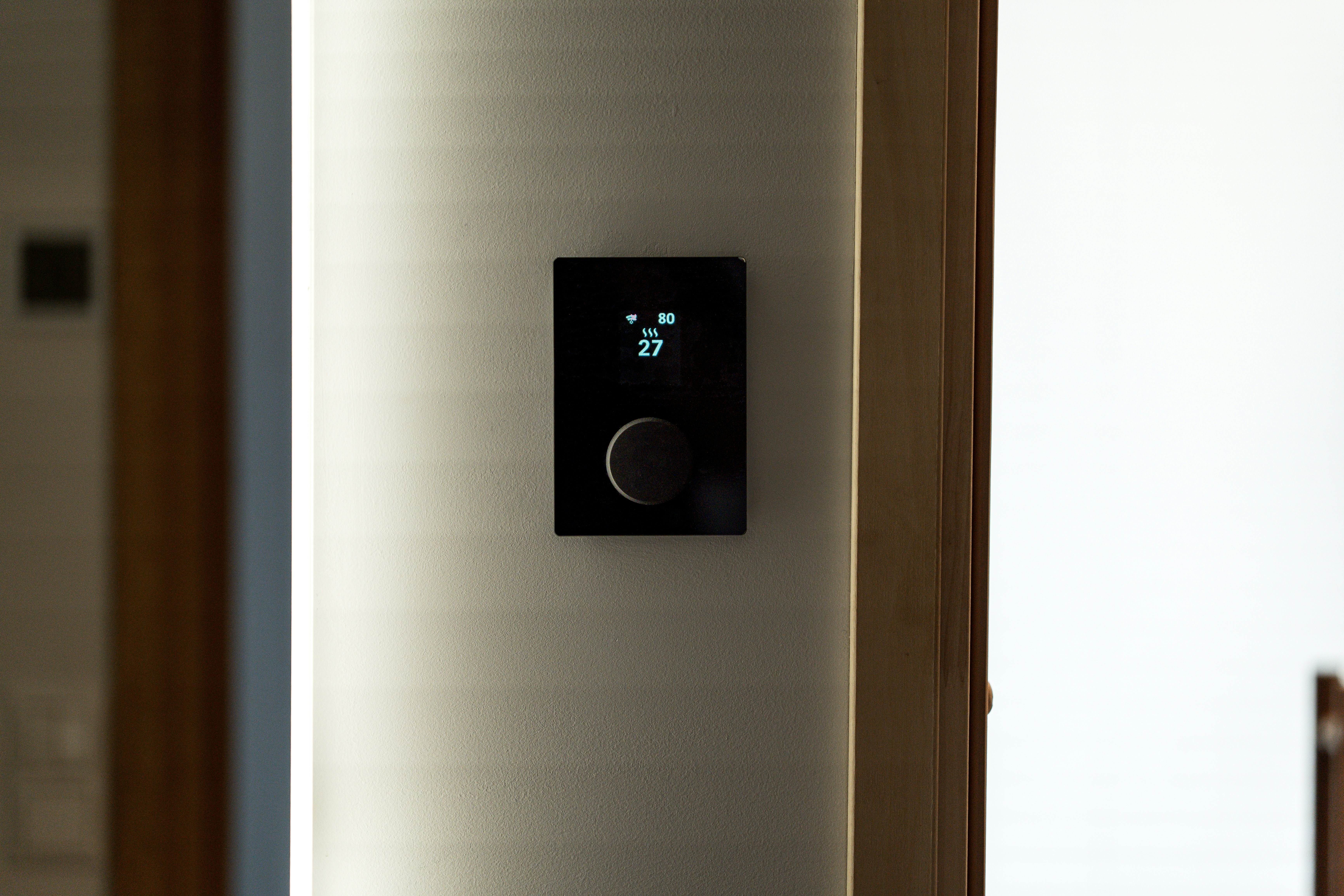 Thermostat being adjusted